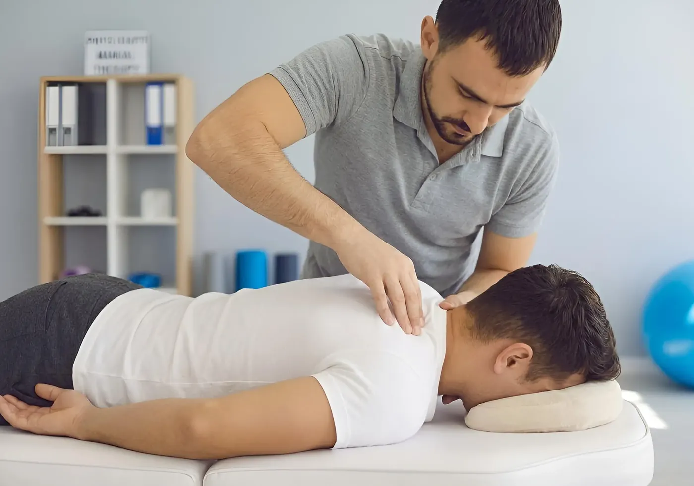 Therapist using hands-on joint mobilization on a patient's shoulder