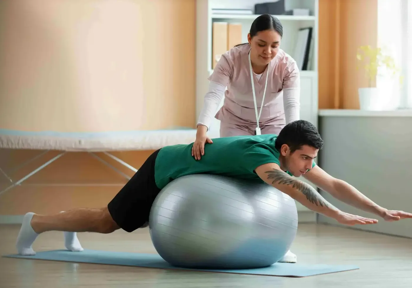 Patient performing a guided exercise over a therapy ball